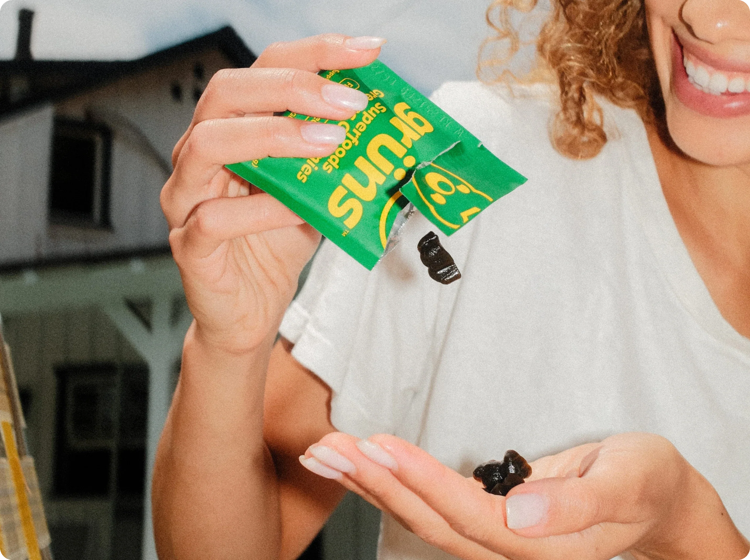 A lifestyle image of Grüns daily gummy supplements